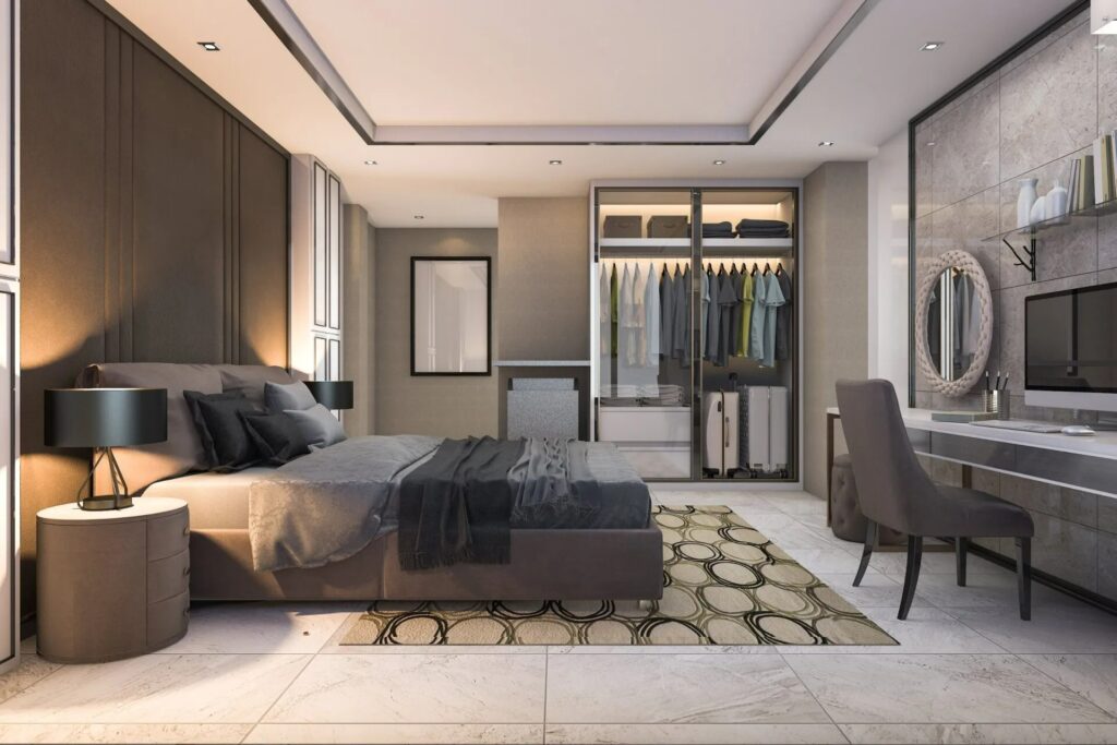 Modern bedroom with fitted wardrobe, stylish bed, bedside lamps, and desk, showcasing bespoke woodwork and interior design elements.